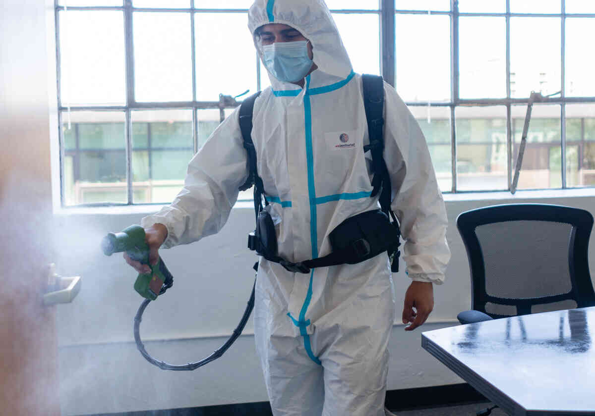 A man cleaning the pesticides in a school